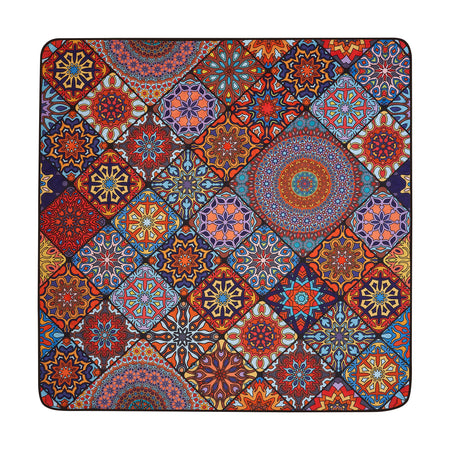 Studio shot of Nakie's picnic blanket in Holiday Dreams color, showcasing its vibrant hue and eco-friendly design made from recycled materials.