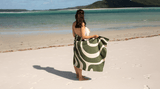 Woman drying herslef on Nakie sand-free recycled beach towel at Moreton Island, Australia Nakie - Australia
