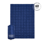 Studio shot of Nakie's Deep Ocean Blue puffy blanket, showcasing its cozy warmth and eco-friendly design, perfect for outdoor adventures and cozy nights. preview #1