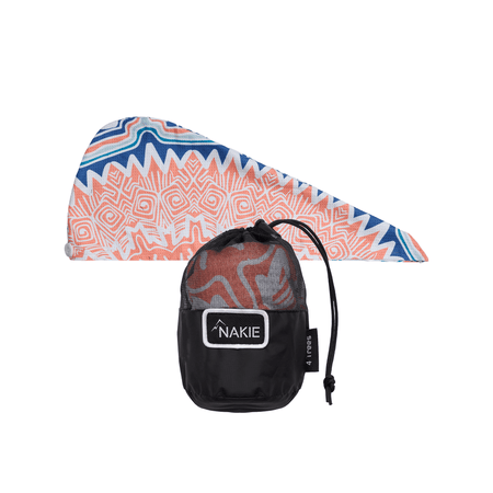 Hair wrap towel in coral and navy geometric pattern with black storage pouch